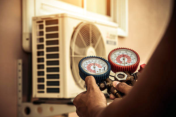 Professional Hvac technician working in Hamilton, MA